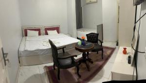 Voodi või voodid majutusasutuse Pharaohs Oasis Hotel toas