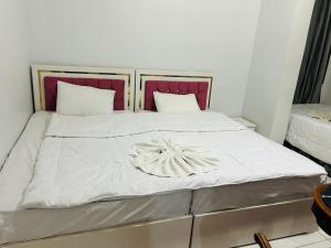 Voodi või voodid majutusasutuse Pharaohs Oasis Hotel toas