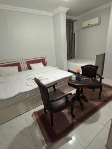 Voodi või voodid majutusasutuse Pharaohs Oasis Hotel toas