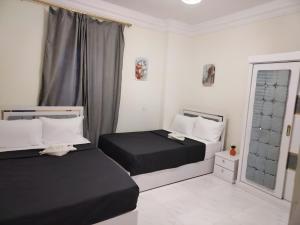 Voodi või voodid majutusasutuse Pharaohs Oasis Hotel toas