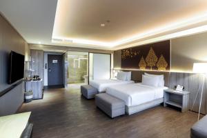 Krevet ili kreveti u jedinici u okviru objekta Amaranta Prambanan Yogyakarta