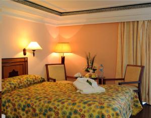 Postel nebo postele na pokoji v ubytování Royal Mirage Fes Hotel