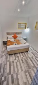 Ένα ή περισσότερα κρεβάτια σε δωμάτιο στο Neo & Ruks Guest Houses Boston Belleville 6