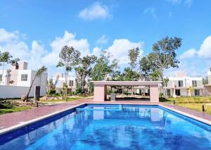a swimming pool in the backyard of a villa at Casas Marina Turquesa in Cancún