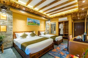 Ένα ή περισσότερα κρεβάτια σε δωμάτιο στο Bar Peepal Resort