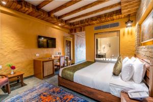 Ένα ή περισσότερα κρεβάτια σε δωμάτιο στο Bar Peepal Resort