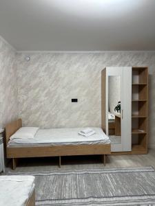 Postel nebo postele na pokoji v ubytování BUGU Guest House