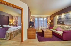 Ein Bett oder Betten in einem Zimmer der Unterkunft Hotel Sommer-Haus am See