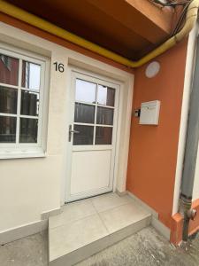 a front door of a house with the number at Kochet Pitters Home in Sibiu +1 photo