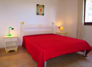Postel nebo postele na pokoji v ubytování Apartment no 16 I Mirti di Porto Pozzo