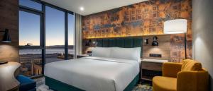 a hotel room with a bed and a window at Doubletree By Hilton Suites Trabzon Yomra in Trabzon +67 photos