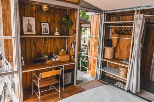 a room with a desk and a chair in a house at Shiva Lodge in Ko Tao