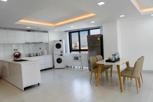 Kuchyň nebo kuchyňský kout v ubytování Noden Hotel & Apartment