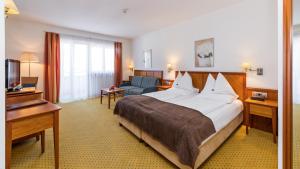 Ένα ή περισσότερα κρεβάτια σε δωμάτιο στο Hotel Millanderhof