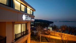 a hotel with a view of the water at night at Ezkar Bathonea Art İstanbul in Avcılar