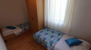 Postel nebo postele na pokoji v ubytování Apartment in Malinska 12
