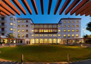 a large white building with a large lawn in front of it at Iberostar Heritage Grand Mencey in Santa Cruz de Tenerife