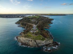an island in the middle of the water at Cotswold House in Falmouth