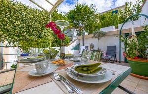 a table with plates of food on a patio at Beautiful Villa Ana with sea view in Crikvenica in Crikvenica