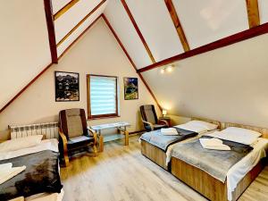 Postel nebo postele na pokoji v ubytování Apartamenty Rodzinne