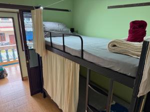 a pair of bunk beds in a room at Penny Hostel & Cafe in Thong Sala