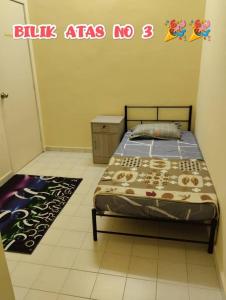 Ένα ή περισσότερα κρεβάτια σε δωμάτιο στο Zunnurain Homestay