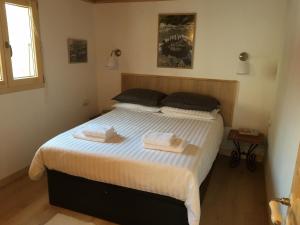 Cama ou camas em um quarto em Sherpa