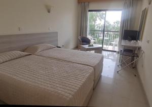 Postel nebo postele na pokoji v ubytování Veronica Hotel