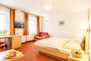 Łóżko lub łóżka w pokoju w obiekcie Hotel Glasererhaus