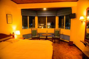 Postel nebo postele na pokoji v ubytování Windsor Hotel + 14 fotografií