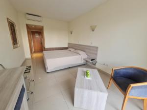 Postel nebo postele na pokoji v ubytování Veronica Hotel