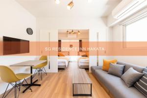 TV a/nebo společenská místnost v ubytování SG RESIDENCE INN HAKATA