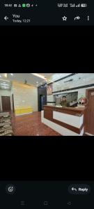 a picture of a room with a person in a kitchen at Shri Bankey Bihari Home Stay in Vrindāvan