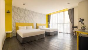 凝萃文旅 台中車站店 NCH-Business Hotel客房内的一张或多张床位