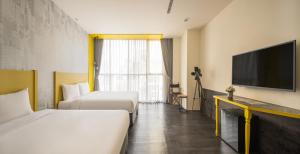 凝萃文旅 台中車站店 NCH-Business Hotel客房内的一张或多张床位