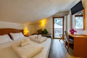 Postel nebo postele na pokoji v ubytování Hotel Grizzly