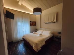 A bed or beds in a room at Il Pradicciolo Agriturismo