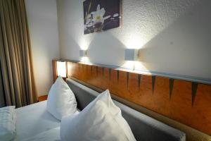 Postel nebo postele na pokoji v ubytování Hotel Martina