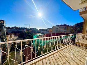 a balcony with a view of a city at Casa Dante in Finale Ligure