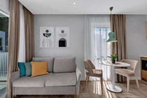 a living room with a couch and a table at Villa Anchor in Baška Voda