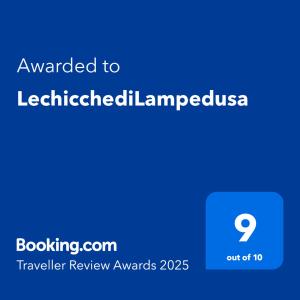 a blue sign with the text awarded to at LechicchediLampedusa in Lampedusa