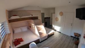 a bedroom with a large bunk bed in a room at Beskidzka Guest House in Szczyrk