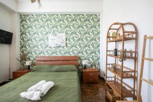 Posteľ alebo postele v izbe v ubytovaní Maison Renée Viareggio