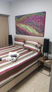 Posteľ alebo postele v izbe v ubytovaní Praxitelous Apartments by Athens Urban Retreat + 32 fotografií