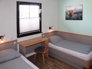 Postel nebo postele na pokoji v ubytování Ferienhaus Nr 14, Kategorie Komfort, Feriendorf Hochbergle, Allgäu