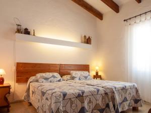 A bed or beds in a room at Villa Es Mirador de ses Altines