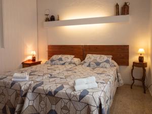 A bed or beds in a room at Villa Es Mirador de ses Altines