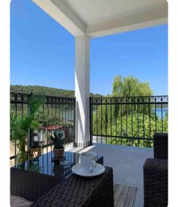 a balcony with a view of the ocean at ''ROOM 6'' - breakfast included in Kampor