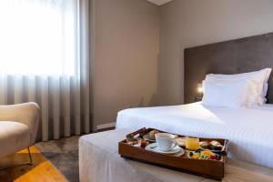 Cama ou camas em um quarto em Avenida Boutique Hotel
