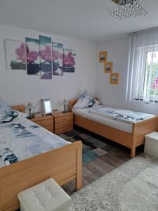 Ένα ή περισσότερα κρεβάτια σε δωμάτιο στο Ferienwohnung Galina 1